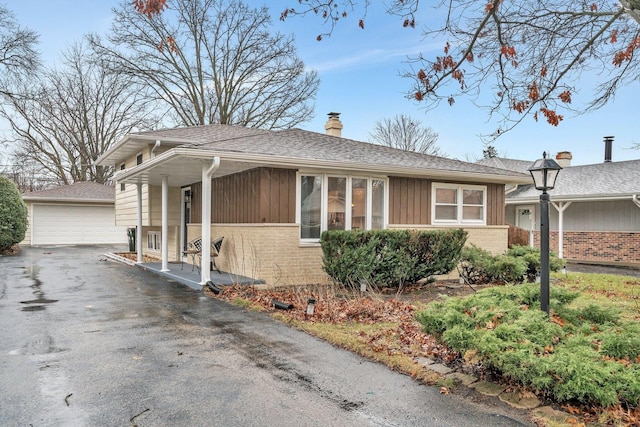 view of front of home featuring an outdoor structure and a garage