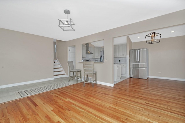 unfurnished living room featuring light hardwood / wood-style floors