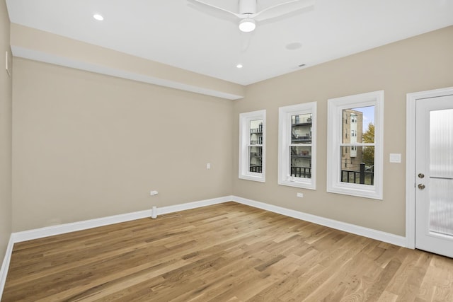 unfurnished room featuring ceiling fan and light wood-type flooring