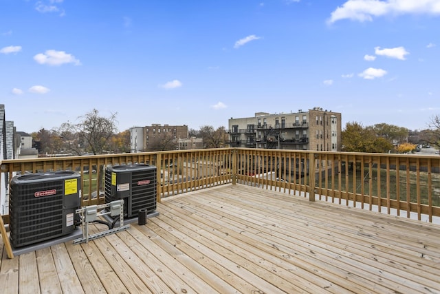 wooden terrace featuring cooling unit