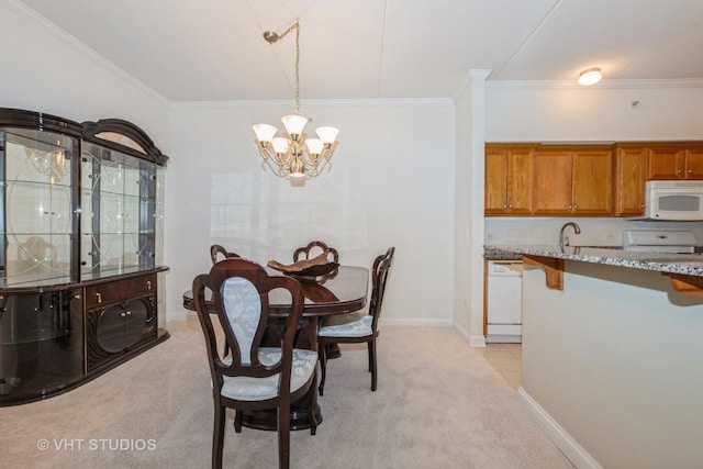 dining area featuring ornamental molding and light carpet