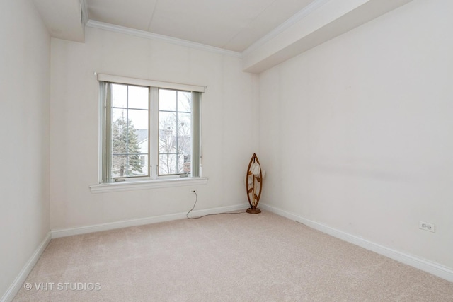 carpeted spare room with crown molding