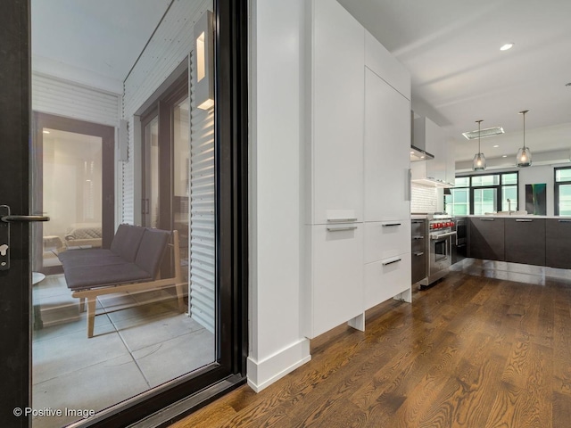 corridor with dark wood-type flooring