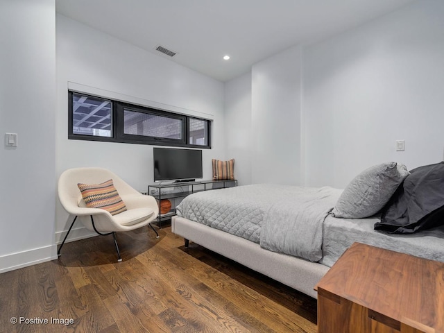 bedroom featuring dark wood-type flooring