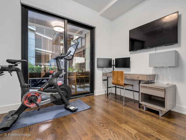 exercise area with wood-type flooring