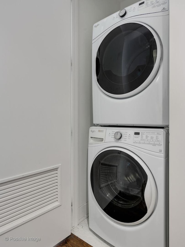 washroom with stacked washer / dryer