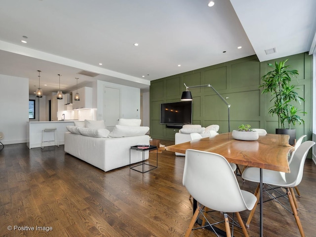 dining space featuring dark wood-type flooring