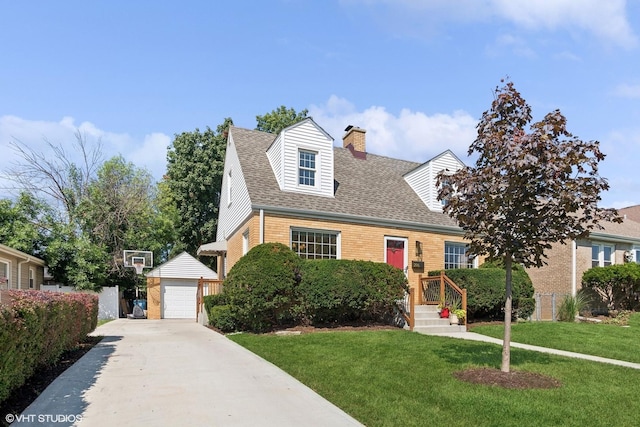 cape cod-style house featuring an outbuilding, a front lawn, and a garage