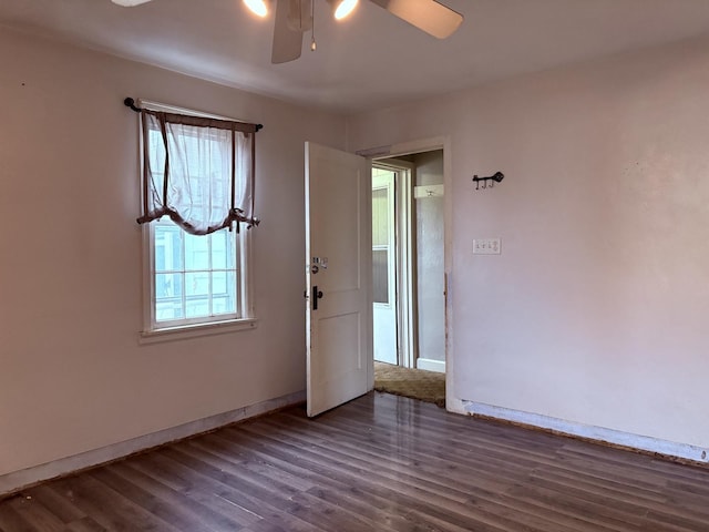 interior space featuring ceiling fan and dark hardwood / wood-style flooring