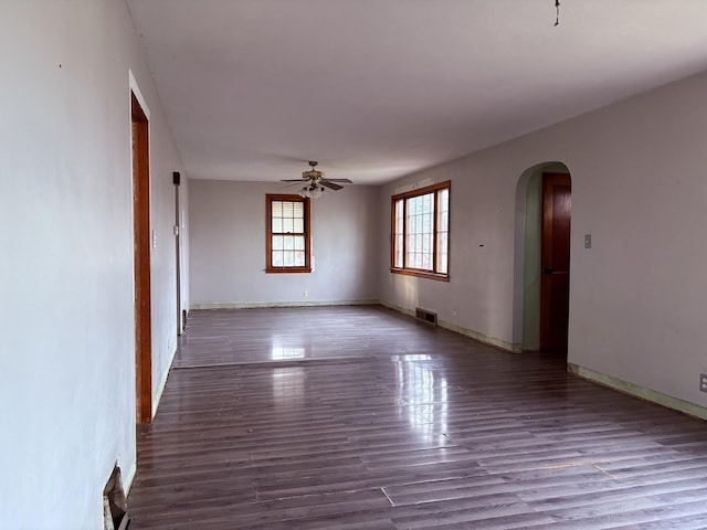 spare room with ceiling fan and hardwood / wood-style flooring