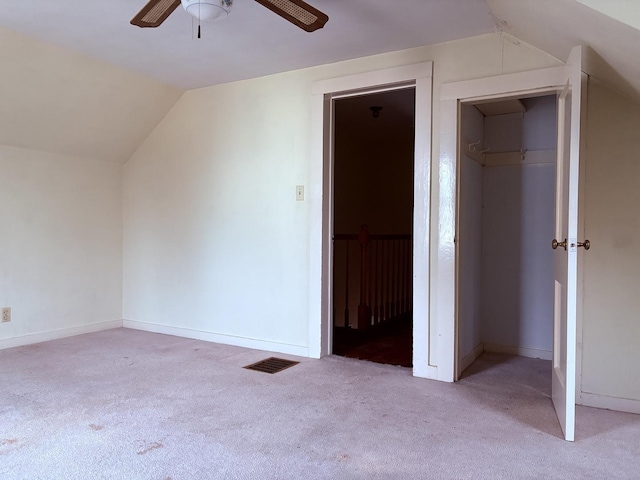 bonus room with ceiling fan, light carpet, and vaulted ceiling