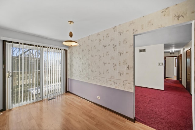 empty room featuring hardwood / wood-style flooring