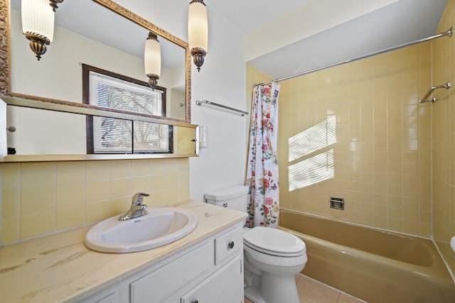 full bathroom featuring tile patterned flooring, backsplash, toilet, shower / tub combo with curtain, and vanity