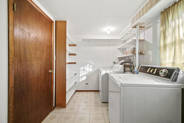 clothes washing area with independent washer and dryer