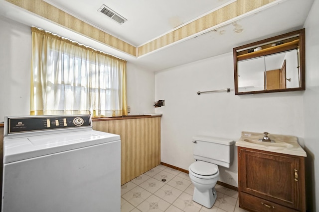 washroom with washer / dryer and sink