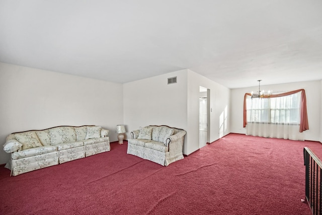 carpeted living room with a chandelier