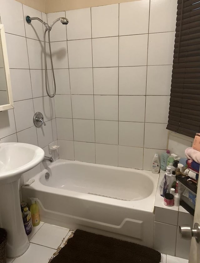 bathroom with tile patterned floors and tiled shower / bath