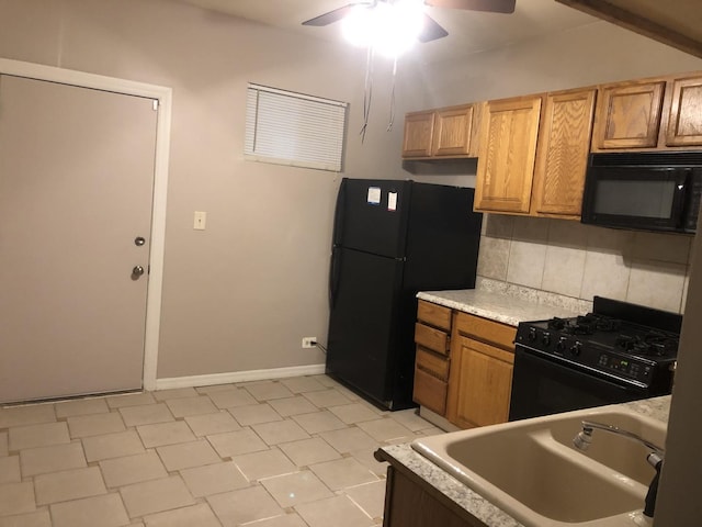 kitchen featuring tasteful backsplash, ceiling fan, sink, and black appliances