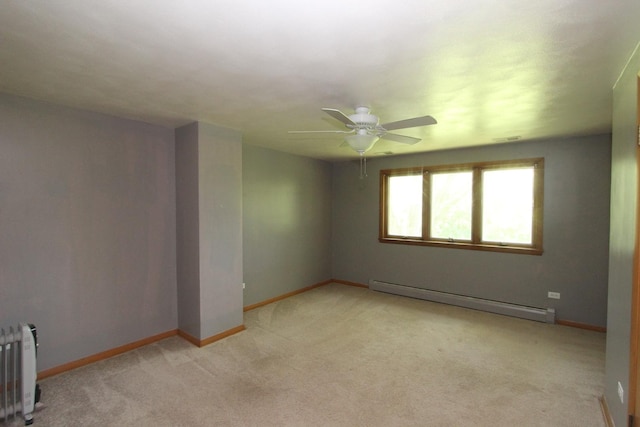 empty room featuring ceiling fan, light colored carpet, radiator heating unit, and baseboard heating