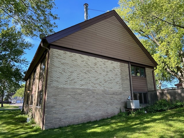 view of property exterior featuring a yard and cooling unit