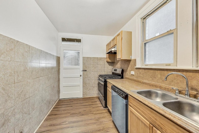 kitchen featuring sink, light hardwood / wood-style flooring, tile walls, light brown cabinetry, and stainless steel appliances