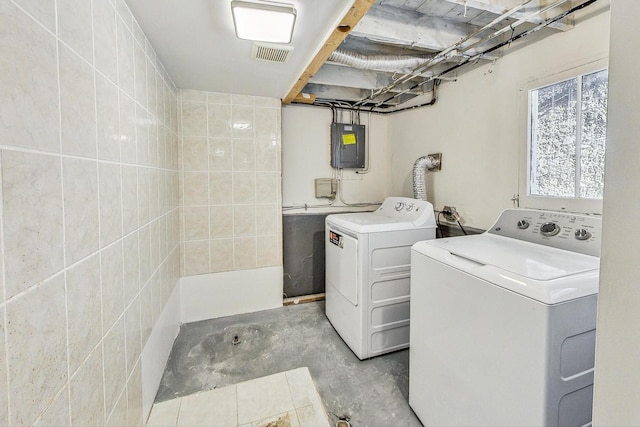 laundry area featuring washer and dryer and electric panel