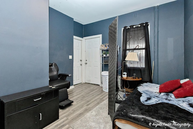 bedroom with light hardwood / wood-style flooring