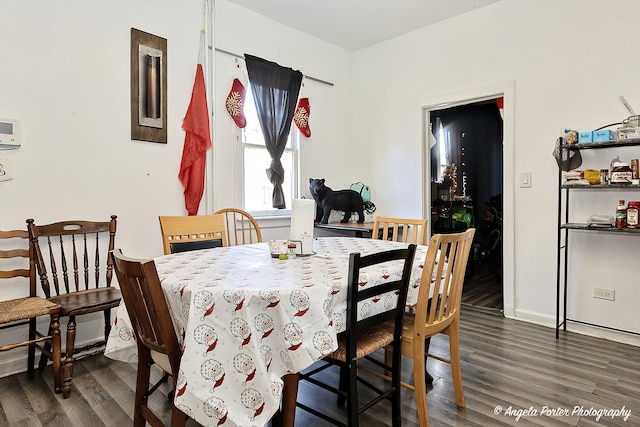 dining area with dark wood-type flooring