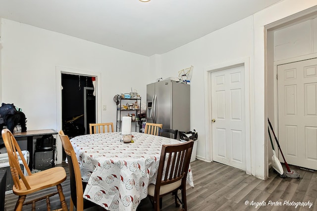 dining space featuring dark hardwood / wood-style floors