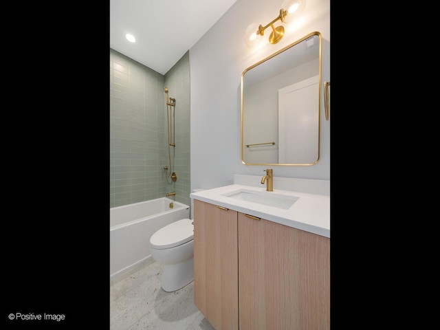 full bathroom with vanity, toilet, and tiled shower / bath