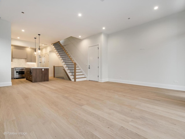 unfurnished living room with light wood-type flooring