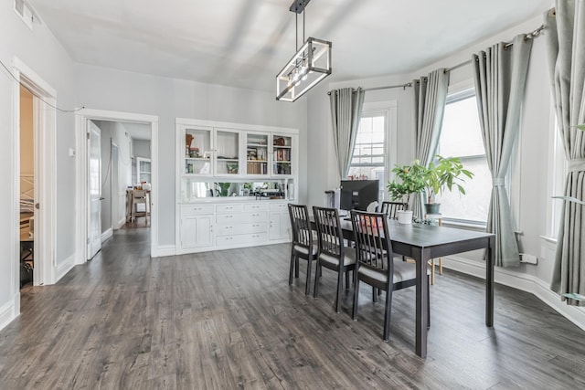 dining area featuring dark hardwood / wood-style floors