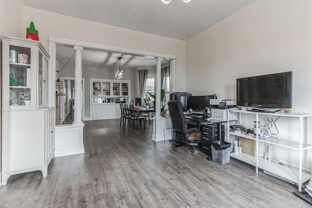 office area featuring wood-type flooring and ornate columns