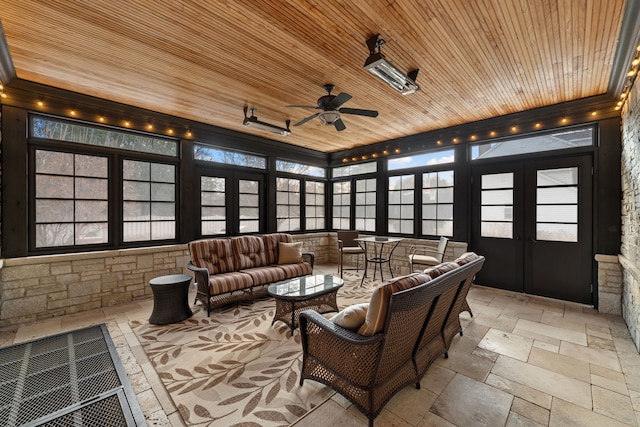 sunroom / solarium with ceiling fan, french doors, and wood ceiling