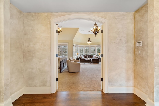 hallway with hardwood / wood-style flooring