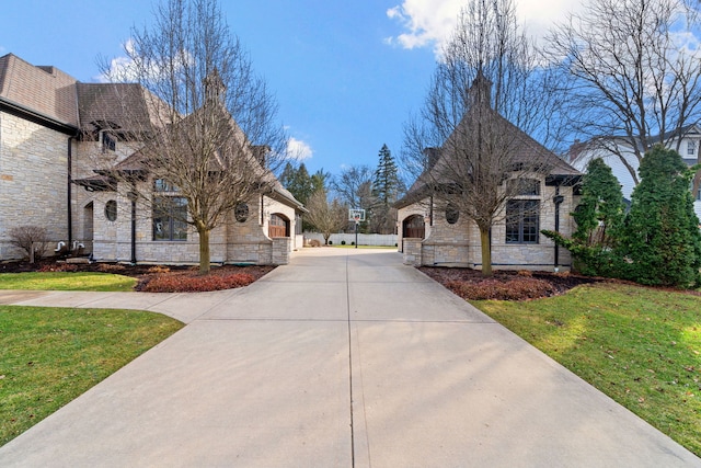 exterior space featuring a front lawn and a garage