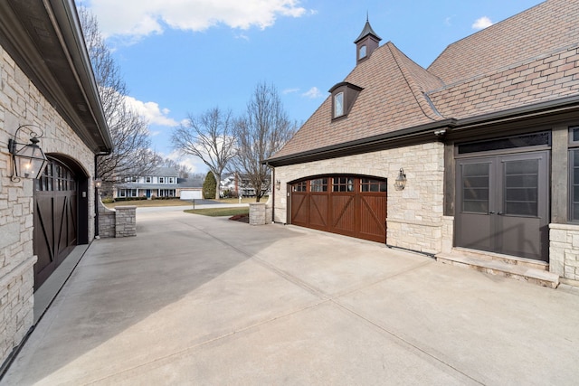 view of side of property with a garage