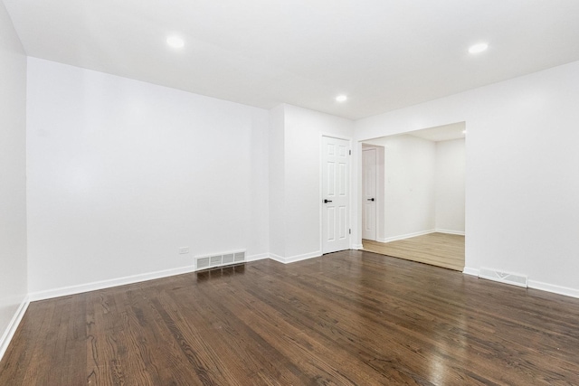 unfurnished room featuring dark hardwood / wood-style floors