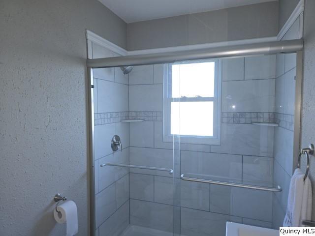 bathroom featuring walk in shower