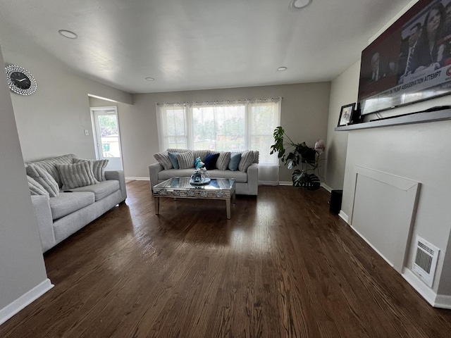 living room with dark hardwood / wood-style floors