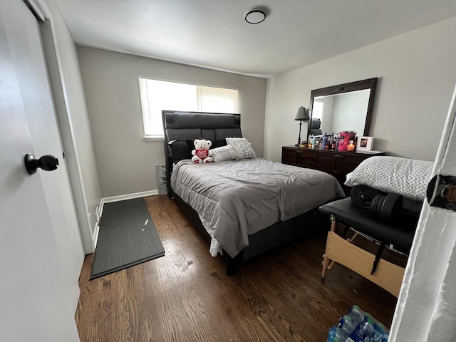 bedroom featuring dark hardwood / wood-style flooring