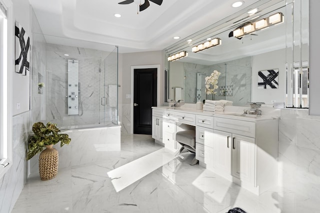 bathroom with an enclosed shower, vanity, a tray ceiling, and ceiling fan