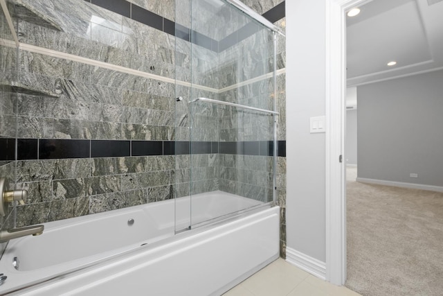 bathroom featuring tile patterned flooring and enclosed tub / shower combo