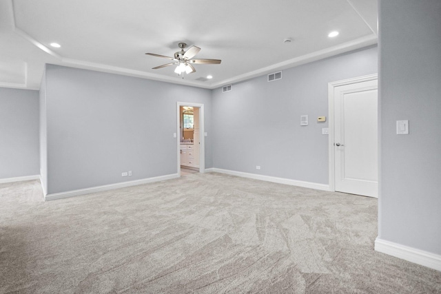 carpeted spare room with ceiling fan