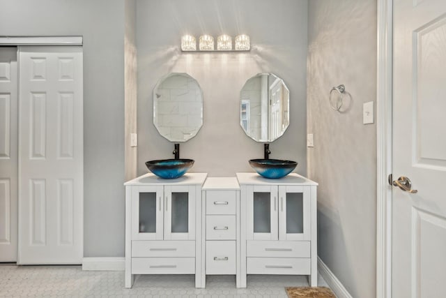 bathroom featuring tile patterned flooring and vanity