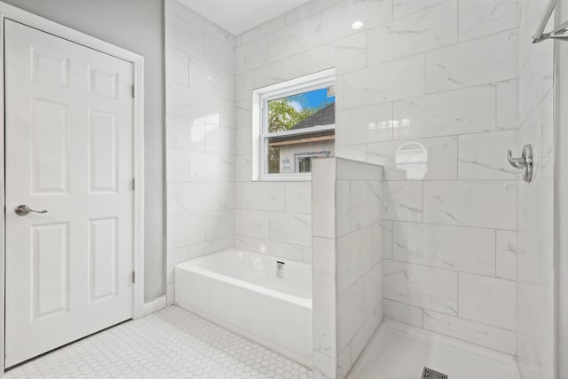 bathroom with separate shower and tub