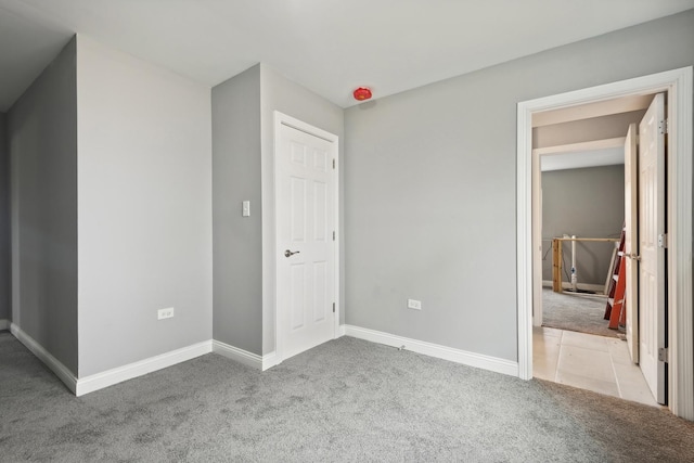 unfurnished bedroom featuring light colored carpet