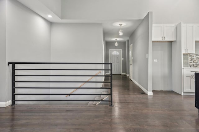 hall with dark hardwood / wood-style floors