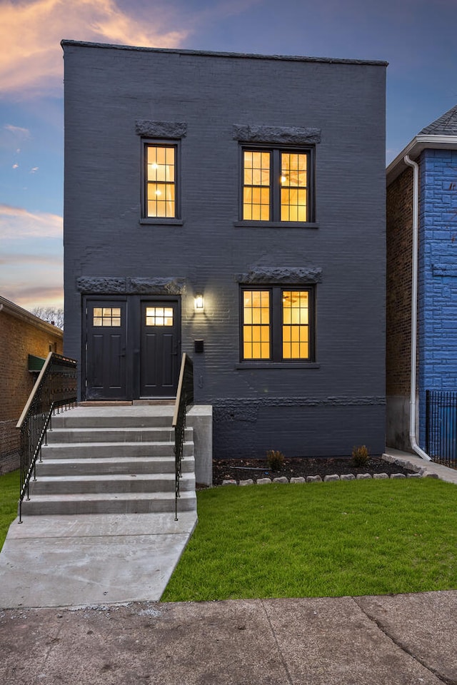 view of front of house with a yard