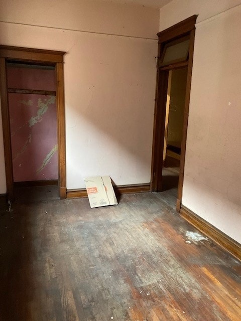 unfurnished room featuring dark hardwood / wood-style floors